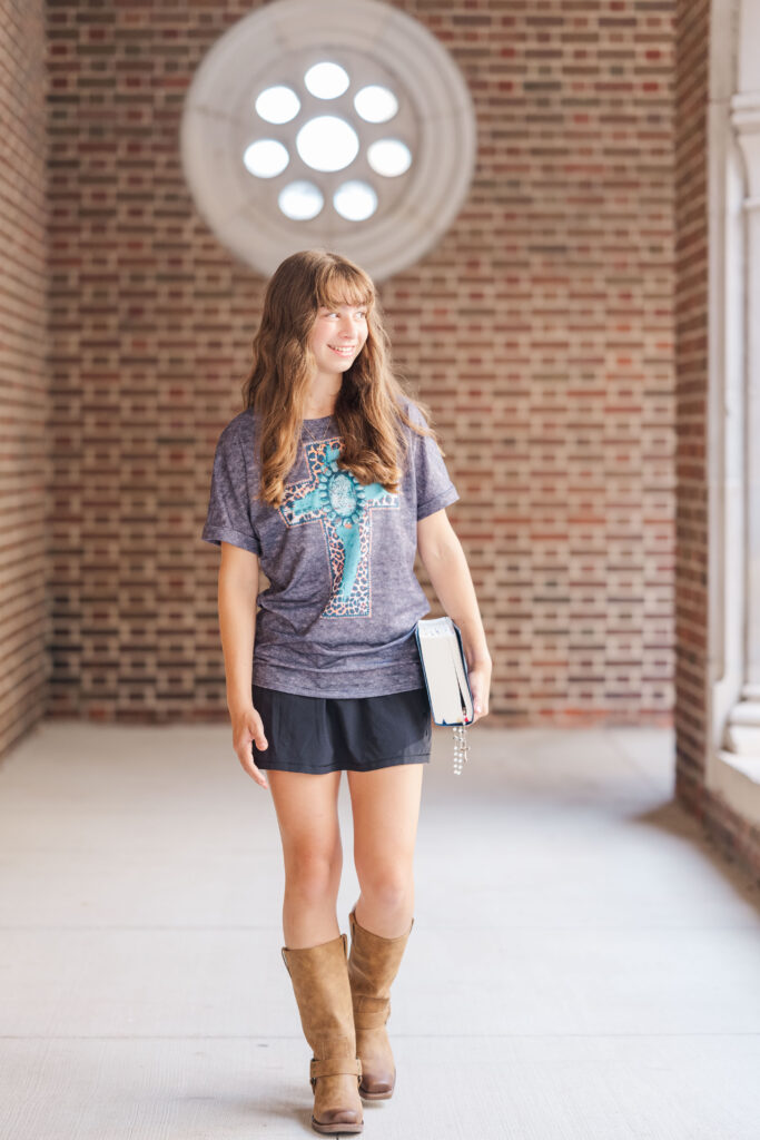 high school senior walks along St. Ambrose Catholic Church walkway

Downtown Des Moines Senior Photos