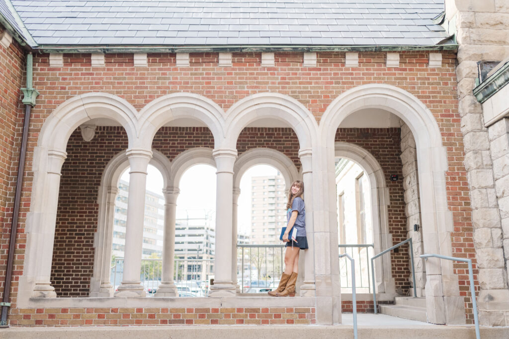 Senior leans on stone archway at St. Ambrose Catholic Church

Downtown Des Moines senior photos